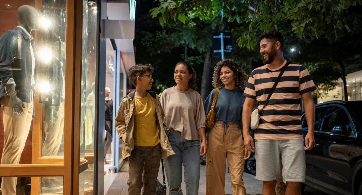 Family walking outdoors after shopping.