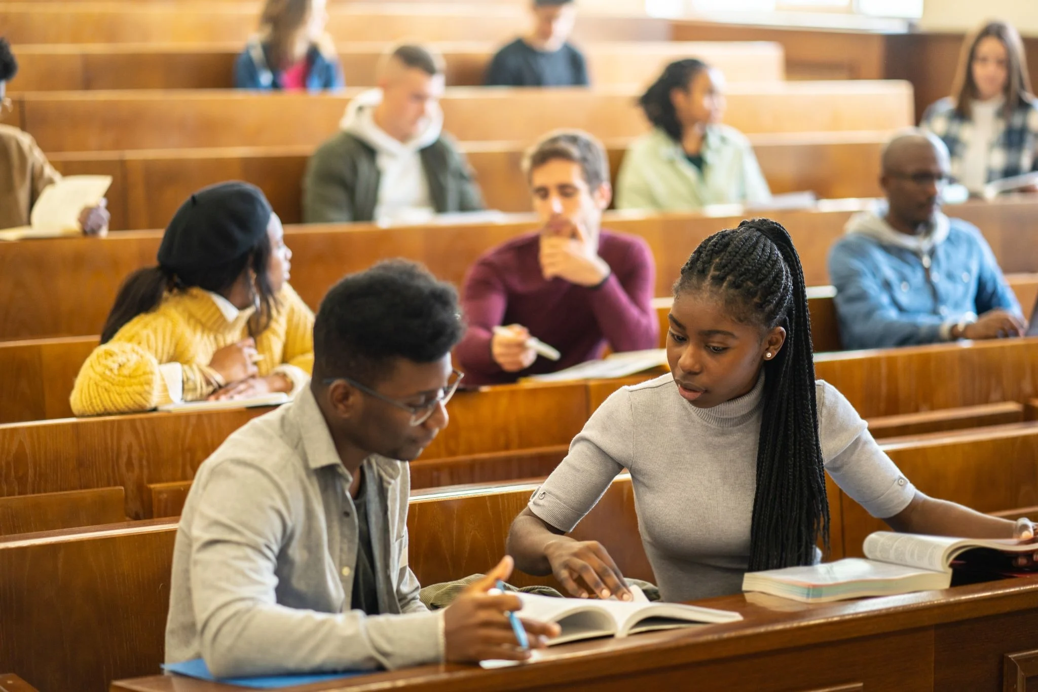 Two students studying in a classroom.